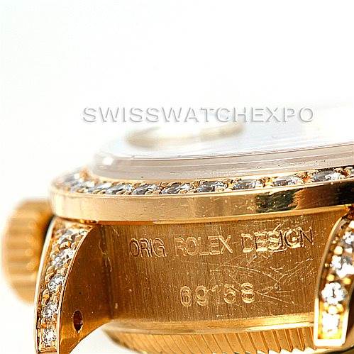 This image shows a close-up of the side of a Rolex President 69158 Women's Yellow Gold Champagne Dial 69158 Women's Yellow Gold Champagne Dial model watch, focusing on the engraved case and bezel with diamonds.
