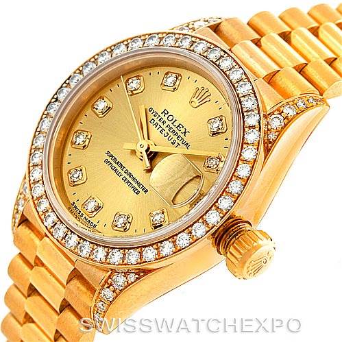 This image shows a close-up angle of a Rolex President 69158 Women's Yellow Gold Champagne Dial 69158 Women's Yellow Gold Champagne Dial model watch featuring its dial, diamond bezel, and partial bracelet.