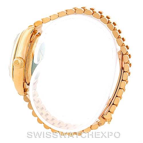 This image shows the side view of a Rolex President 69178 Women's Yellow Gold Champagne Dial 69178 Women's Yellow Gold Champagne Dial model, focusing on the case, crown, and the bracelet.