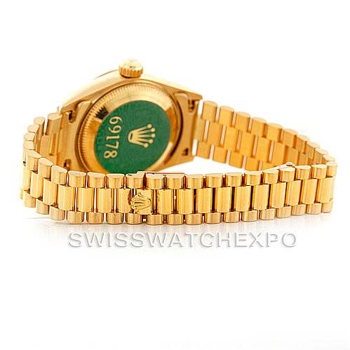 The image shows the back view of a Rolex President 69178 Women's Yellow Gold Champagne Dial 69178 Women's Yellow Gold Champagne Dial model watch, highlighting its gold bracelet and case back.