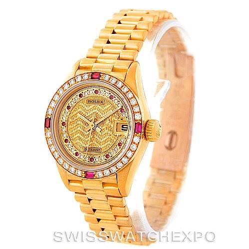 The image shows a front angle of the Rolex President 69178 Women's Yellow Gold Champagne Dial 69178 Women's Yellow Gold Champagne Dial watch, highlighting its gold bracelet, diamond and ruby-set bezel, and detailed dial.