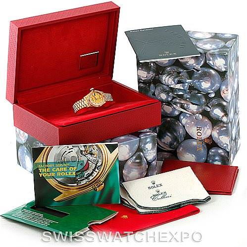 The image shows a Rolex President 69178 Women's Yellow Gold Champagne Dial 69178 Women's Yellow Gold Champagne Dial watch in its red box with accompanying accessories, including manuals, cloth, and packaging.