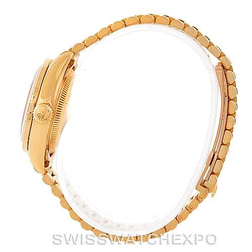 This image shows a side view of a Rolex President 69178 Women's Yellow Gold Champagne Dial 69178 Women's Yellow Gold Champagne Dial model watch, highlighting its crown and bracelet.