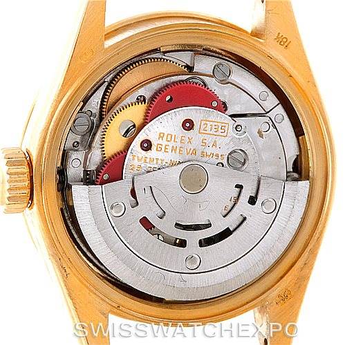 This image shows the inner mechanism of a Rolex President 69178 Women's Yellow Gold Champagne Dial 69178 Women's Yellow Gold Champagne Dial model watch from a rear angle, exposing its intricate gears and movement.