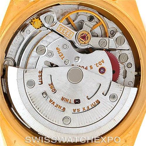The image shows the internal movement mechanism of a Rolex President 79158 Women's Yellow Gold  79158 Women's Yellow Gold  model watch, highlighting gears and components.