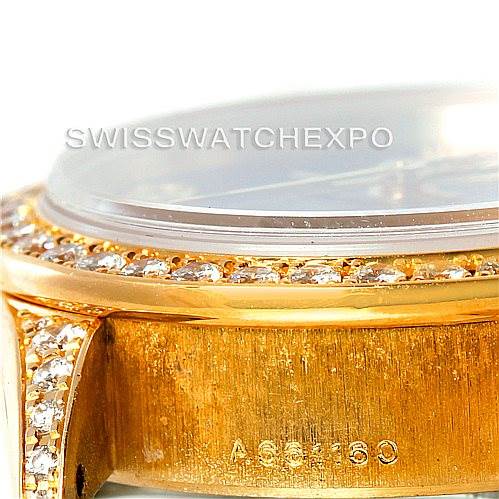 This close-up image shows the side profile of a Rolex President 79158 Women's Yellow Gold  79158 Women's Yellow Gold  model watch, highlighting the diamond bezel and part of the gold case.