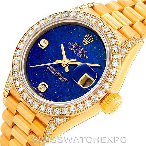 The image shows a Rolex President 79158 Women's Yellow Gold  79158 Women's Yellow Gold  watch with a gold bracelet, blue face, diamond bezel, and gold indices, viewed from the top front angle.