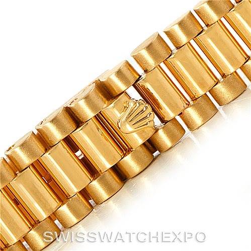 This image shows a close-up of the gold bracelet clasp with the Rolex crown logo from the Rolex President 79158 Women's Yellow Gold  79158 Women's Yellow Gold  model watch.