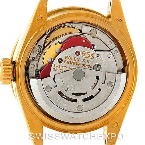 This is the back view of a Rolex President 69138 Women
s Yellow Gold Beige Dial 69138 Women
s Yellow Gold Beige Dial model watch, showing its internal mechanism and movement parts.