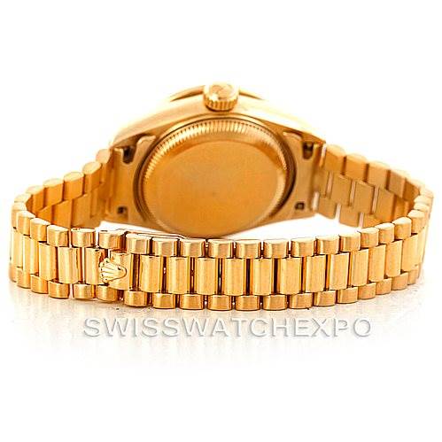 This image shows the back case and bracelet of a Rolex President 69138 Women
s Yellow Gold Beige Dial 69138 Women
s Yellow Gold Beige Dial model watch at a rear angle.