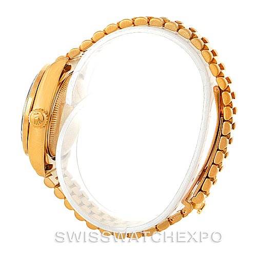 The image shows a side view of a Rolex President 69138 Women
s Yellow Gold Beige Dial 69138 Women
s Yellow Gold Beige Dial model, highlighting the case and bracelet links.