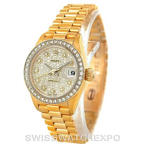 This image shows a Rolex President 69138 Women
s Yellow Gold Beige Dial 69138 Women
s Yellow Gold Beige Dial model watch in a three-quarter view, highlighting its gold bracelet, bezel, dial, and date display.