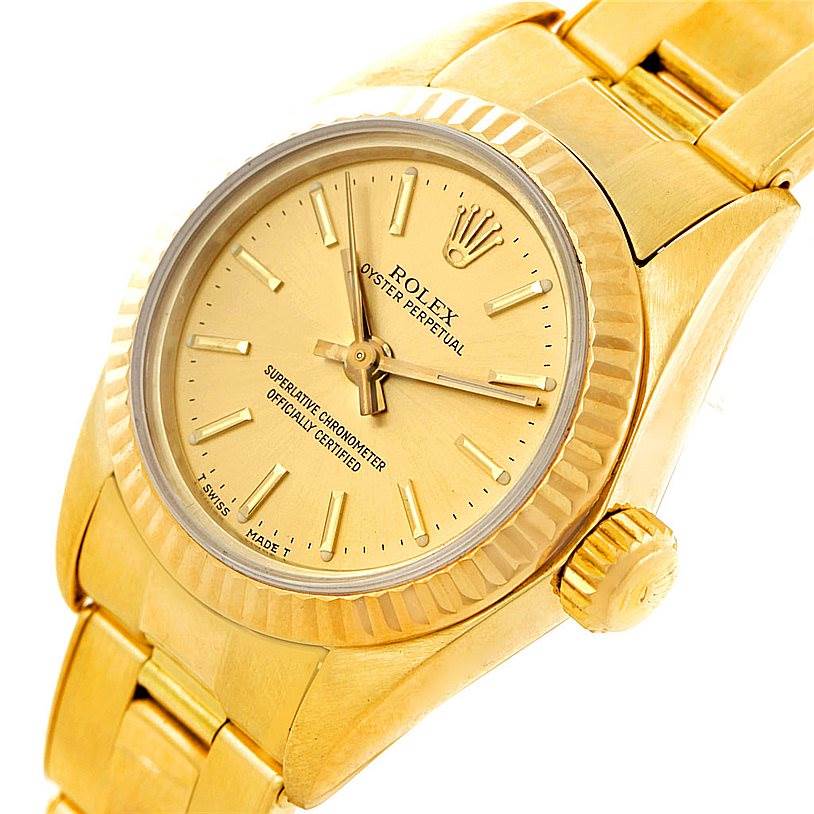 This image shows a close-up of the face and band of a Rolex President 67197 Women's Yellow Gold Champagne Dial 67197 Women's Yellow Gold Champagne Dial model watch, viewed at a slight angle.