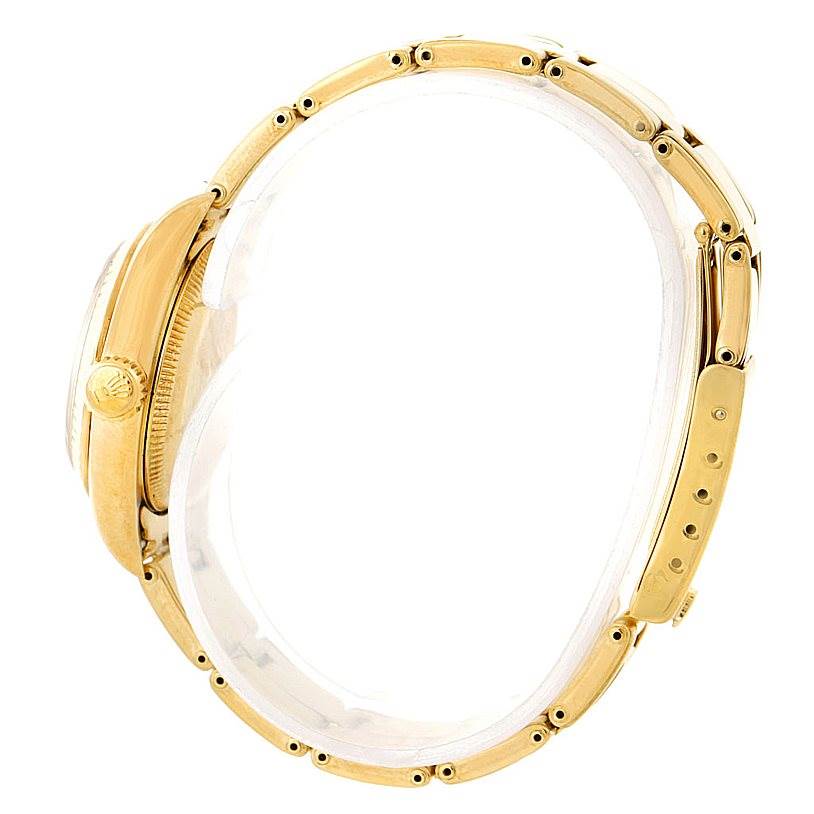 This image shows a side view of the Rolex President 67197 Women's Yellow Gold Champagne Dial 67197 Women's Yellow Gold Champagne Dial model, highlighting the crown, case, and part of the bracelet.