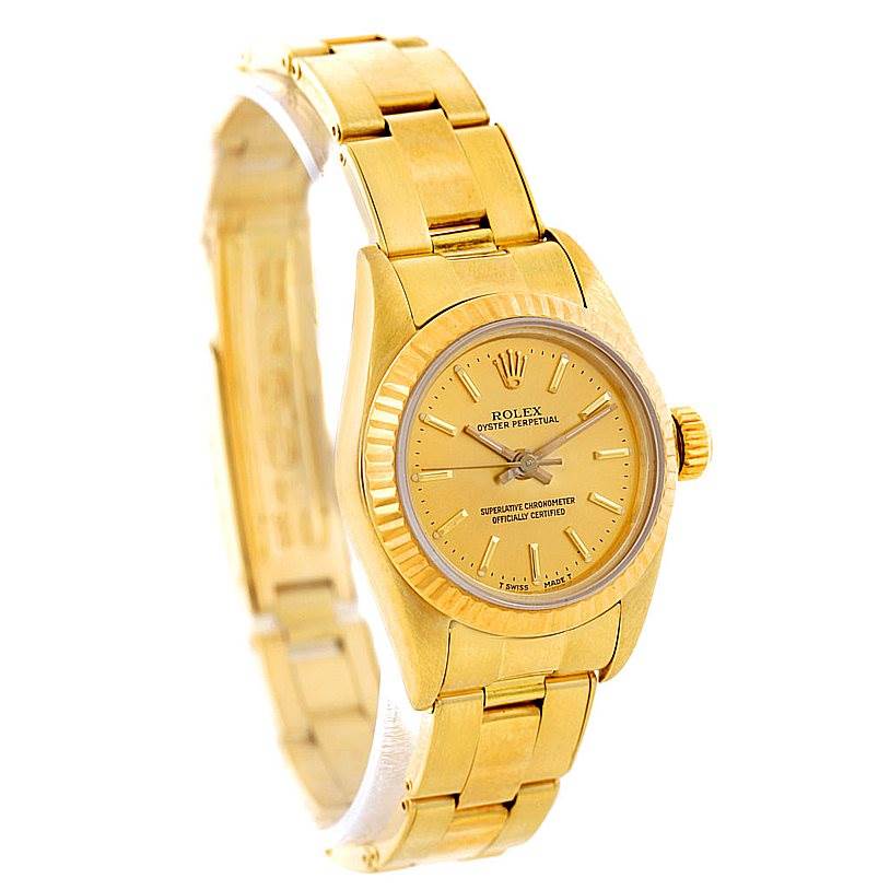 The image shows a Rolex President 67197 Women's Yellow Gold Champagne Dial 67197 Women's Yellow Gold Champagne Dial model watch, highlighting its gold band, fluted bezel, and dial at a three-quarter angle.