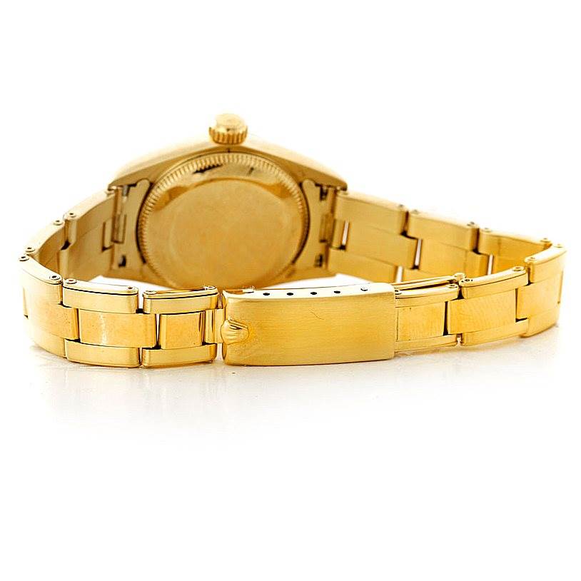 This image shows the back case and bracelet of a Rolex President 67197 Women's Yellow Gold Champagne Dial 67197 Women's Yellow Gold Champagne Dial model watch at a rear angle.
