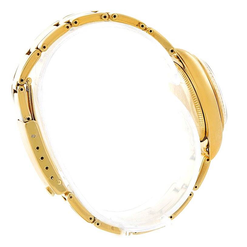 The image shows a side view of a Rolex President 67197 Women's Yellow Gold Champagne Dial 67197 Women's Yellow Gold Champagne Dial model watch highlighting its bracelet and part of the case.