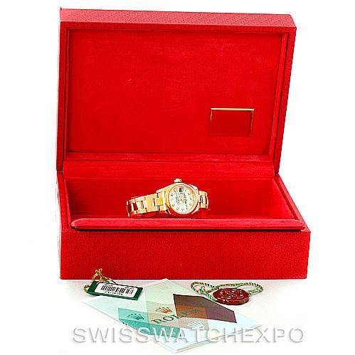 The image shows a Rolex President 179168 Women's Yellow Gold Mother of Pearl Dial 179168 Women's Yellow Gold Mother of Pearl Dial model watch in a red box, along with included accessories and tags displayed in front.
