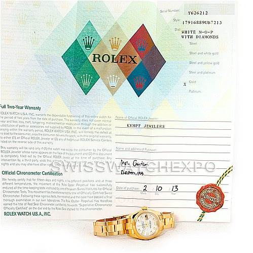 The image shows a Rolex President 179168 Women's Yellow Gold Mother of Pearl Dial 179168 Women's Yellow Gold Mother of Pearl Dial model watch and its warranty certificate displayed from a top-down angle.
