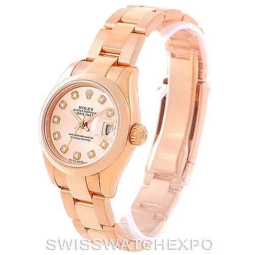 The image shows a Rolex President 179165 Women's Rose Gold Pink Dial 179165 Women's Rose Gold Pink Dial model watch from an oblique angle, featuring its bracelet, case, and dial.