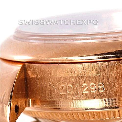 The image shows a close-up of the side of a Rolex President 179165 Women's Rose Gold Pink Dial 179165 Women's Rose Gold Pink Dial model watch, focusing on the serial number engraved on the case.