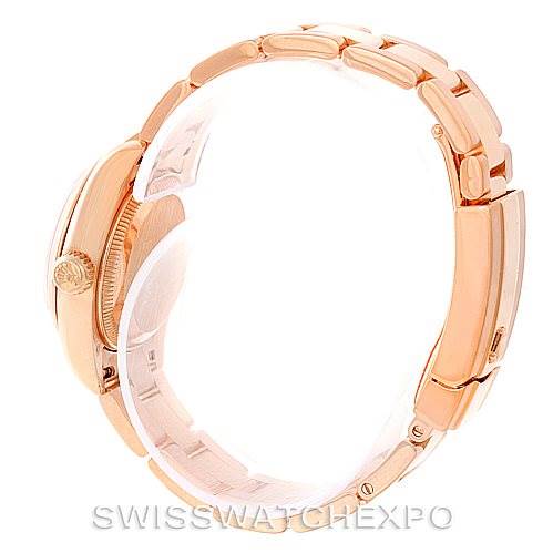 The image shows a side view of the Rolex President 179165 Women's Rose Gold Pink Dial 179165 Women's Rose Gold Pink Dial model watch, highlighting its gold case, crown, and bracelet.
