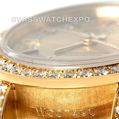 This is a close-up angle of a Rolex President 69158 Women's Yellow Gold Champagne Dial 69158 Women's Yellow Gold Champagne Dial model, showing parts of the diamond-encrusted bezel and the engraved inner case.