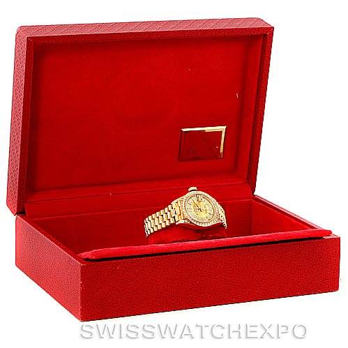 The image shows a Rolex President 69158 Women's Yellow Gold Champagne Dial 69158 Women's Yellow Gold Champagne Dial model watch inside an open red presentation box, viewed from the front.