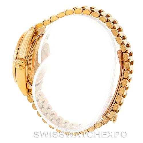 The image shows a side profile of the Rolex President 69158 Women's Yellow Gold Champagne Dial 69158 Women's Yellow Gold Champagne Dial model watch, highlighting its gold case, crown, and bracelet.