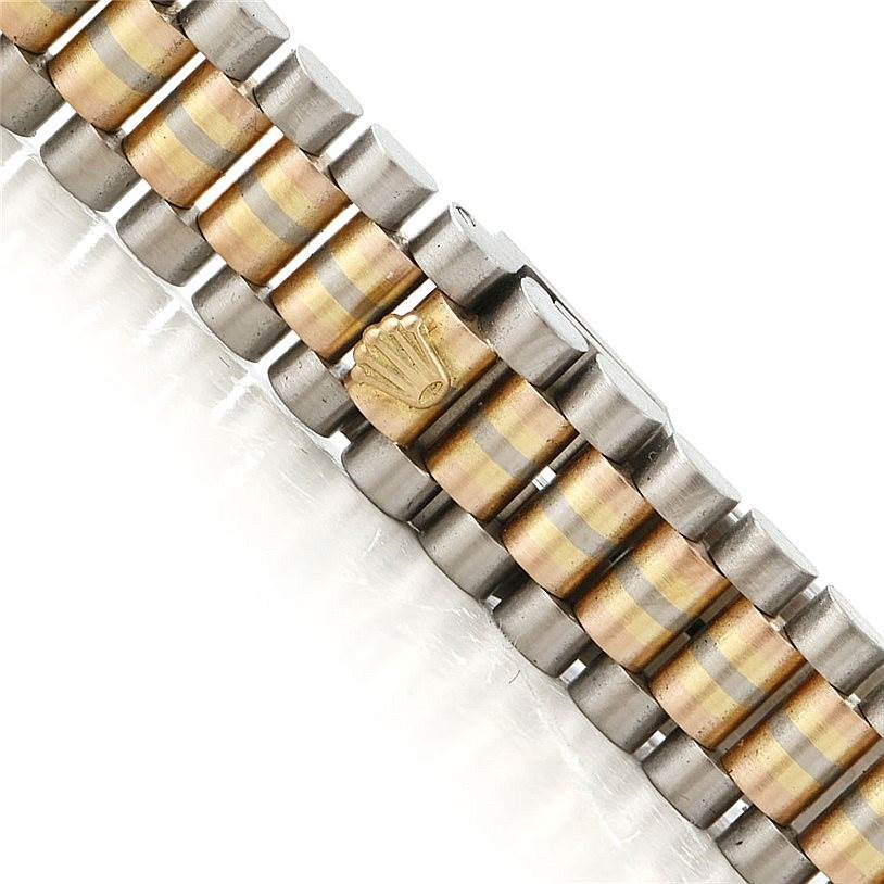 The image shows a close-up of the bracelet of a Rolex President 69179B Women's White Gold Brown Dial 69179B Women's White Gold Brown Dial model watch, highlighting its gold and silver links and the Rolex crown logo.