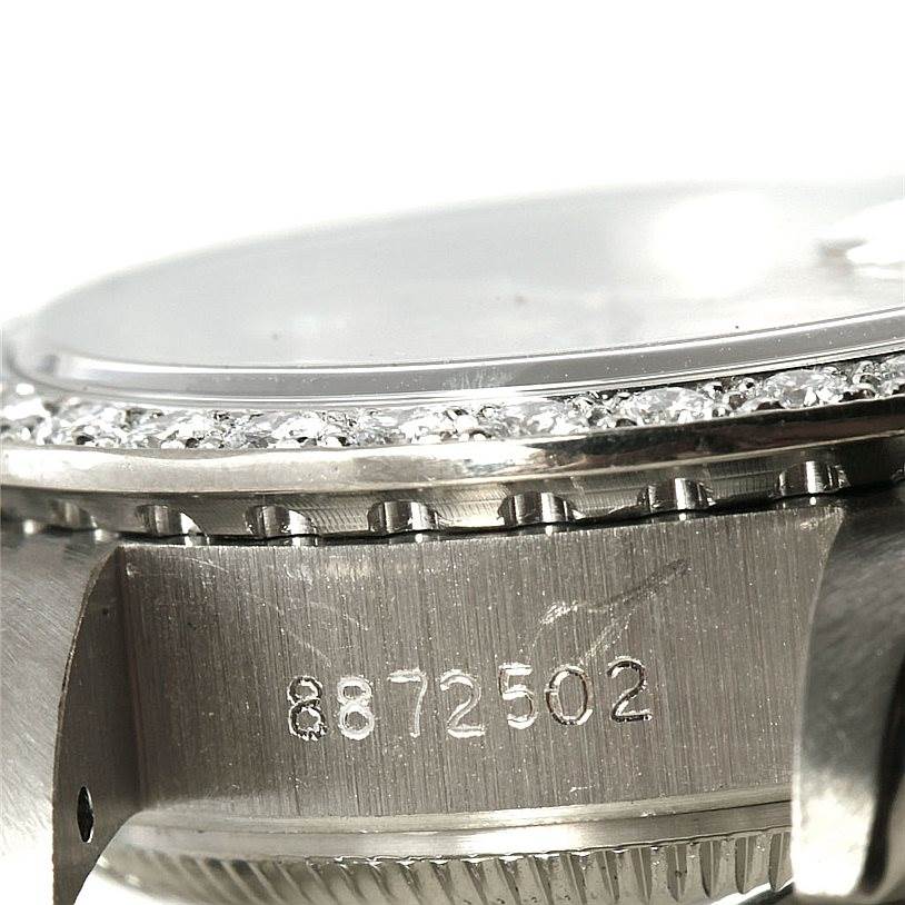 The image shows a close-up side view of the Rolex President 69179B Women's White Gold Brown Dial 69179B Women's White Gold Brown Dial watch, focusing on its serial number and part of the bezel.