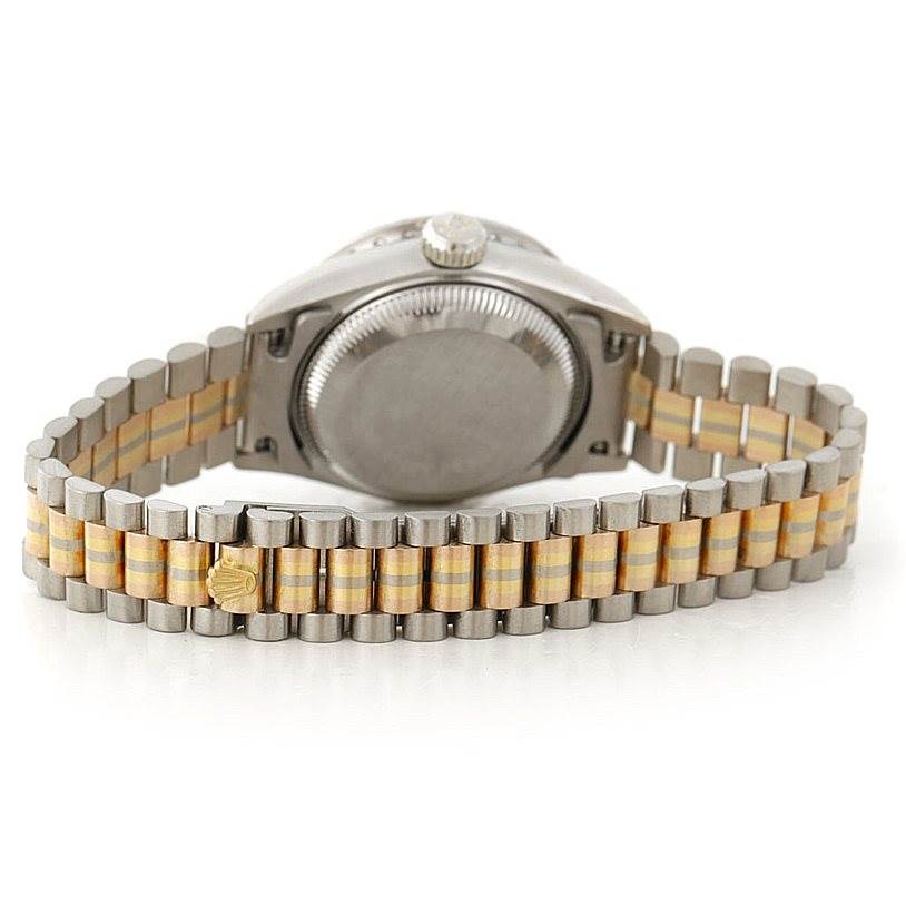 This image shows the back case and gold and silver bracelet of a Rolex President 69179B Women's White Gold Brown Dial 69179B Women's White Gold Brown Dial model watch from a rear angle.