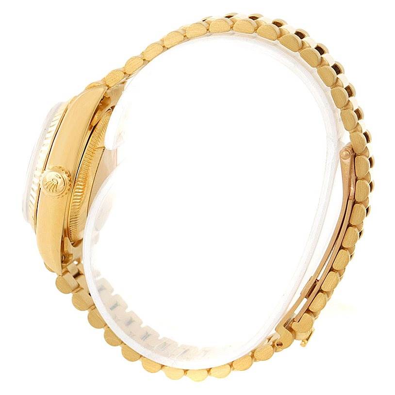 This image shows a side view of the Rolex President 69178 Women's Yellow Gold Champagne Dial 69178 Women's Yellow Gold Champagne Dial model watch, highlighting the crown and bracelet.