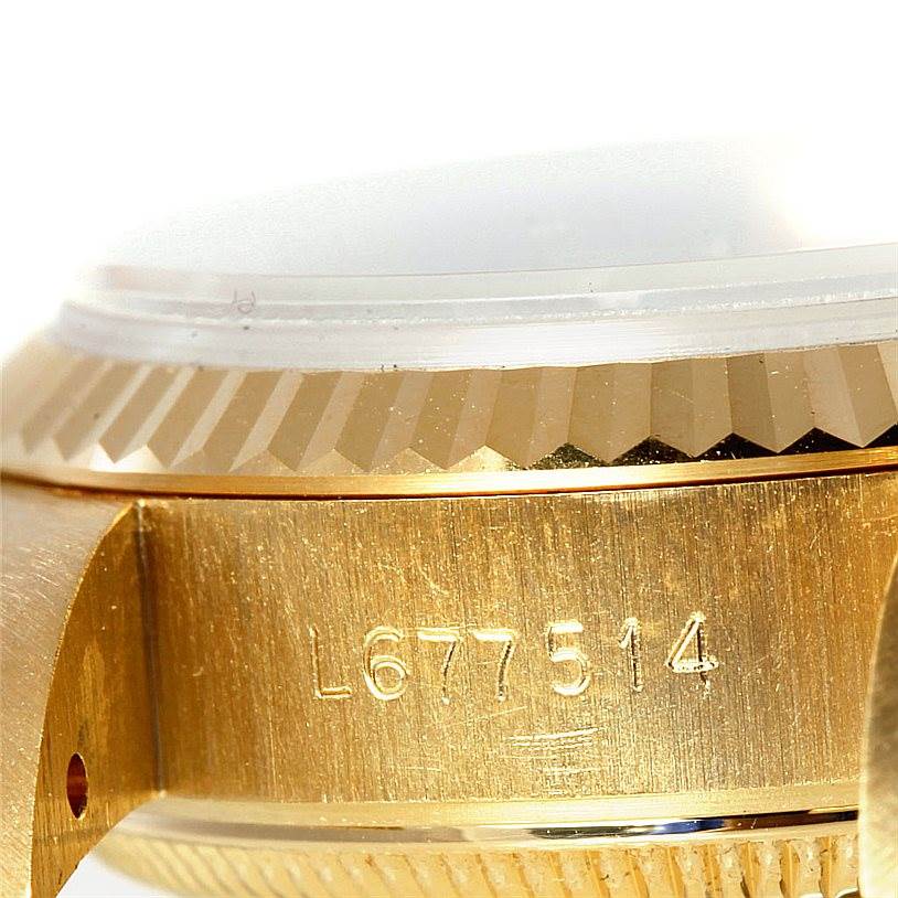 This image shows a close-up of the side case and part of the bezel of a Rolex President 69178 Women's Yellow Gold Champagne Dial 69178 Women's Yellow Gold Champagne Dial model watch.