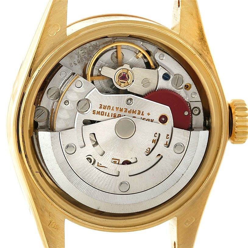 This Rolex President 69178 Women's Yellow Gold Champagne Dial 69178 Women's Yellow Gold Champagne Dial model watch is shown from the back angle, displaying its internal movement and intricate mechanisms.