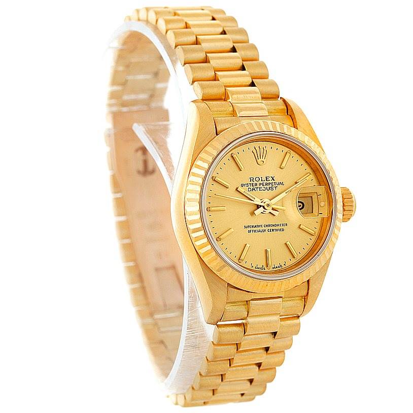 The image shows a slight side angle of a Rolex President 69178 Women's Yellow Gold Champagne Dial 69178 Women's Yellow Gold Champagne Dial model watch, showcasing its face, fluted bezel, and President bracelet.