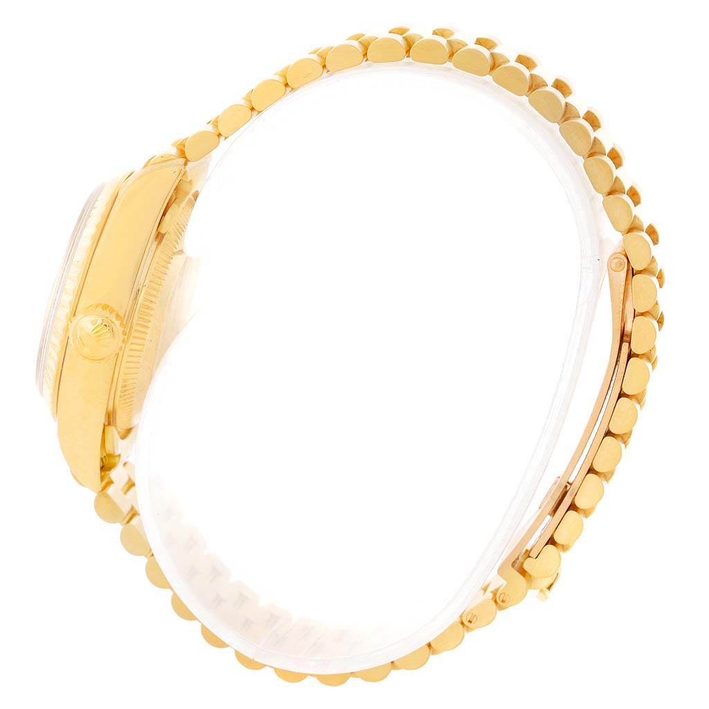 This image shows a side view of the Rolex President 69178 Women's Yellow Gold Beige Dial 69178 Women's Yellow Gold Beige Dial watch, highlighting the gold case, crown, and bracelet.