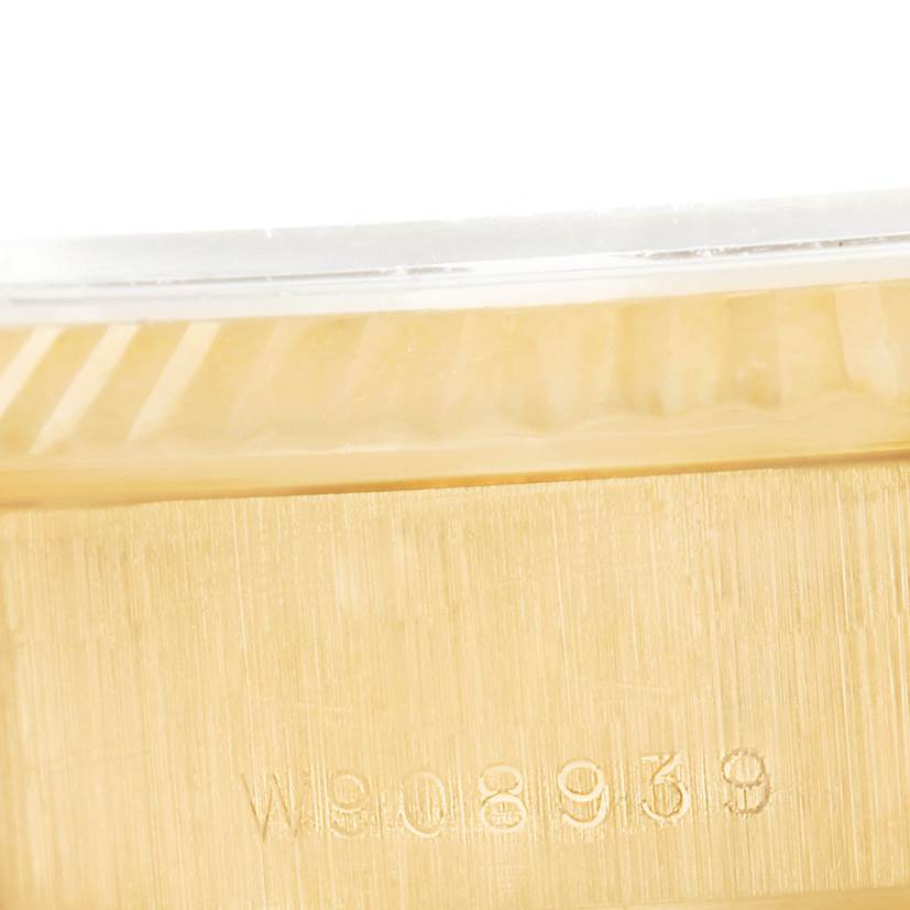 The image shows a close-up angle of the serial number engraving on the gold case of a Rolex President 69178 Women's Yellow Gold Beige Dial 69178 Women's Yellow Gold Beige Dial model watch.