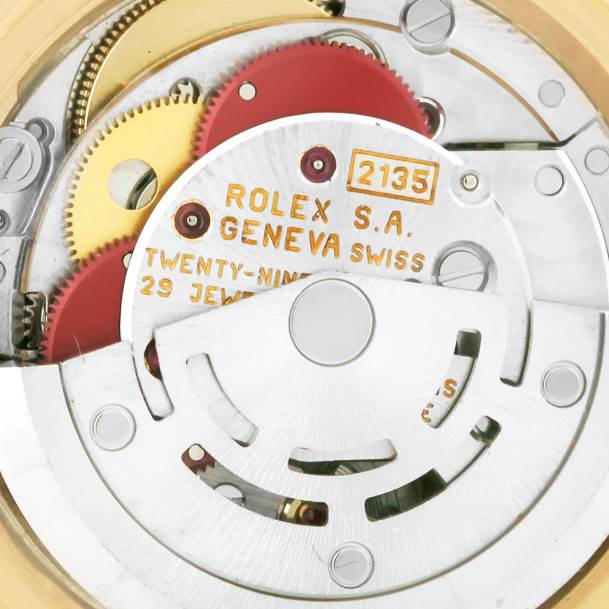 The image shows a detailed view of the inner movement and gears of a Rolex President 69178 Women's Yellow Gold Beige Dial 69178 Women's Yellow Gold Beige Dial model watch.
