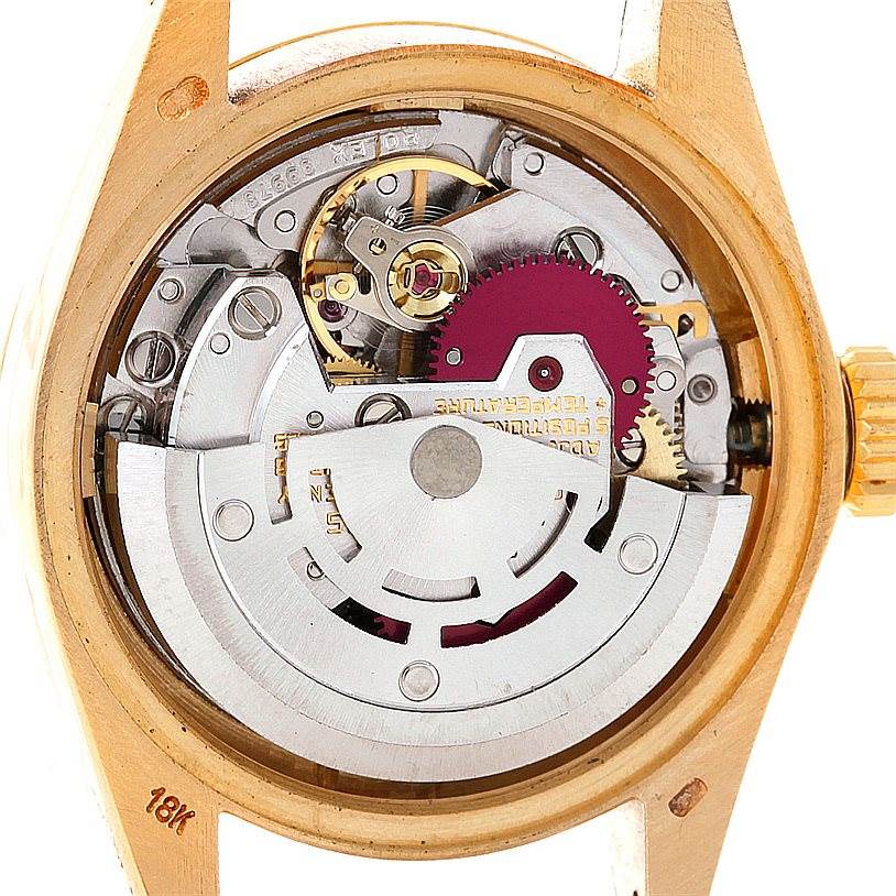 The image shows the internal mechanical movement of a Rolex President 6917 Women's Yellow Gold Brown Dial 6917 Women's Yellow Gold Brown Dial watch, including gears, rotor, and other components, viewed from the back.