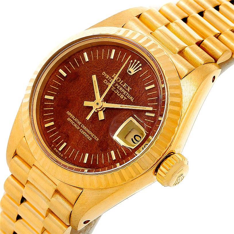 This image shows a close-up of a Rolex President 6917 Women's Yellow Gold Brown Dial 6917 Women's Yellow Gold Brown Dial model watch, highlighting the face, bezel, crown, and a portion of the bracelet.