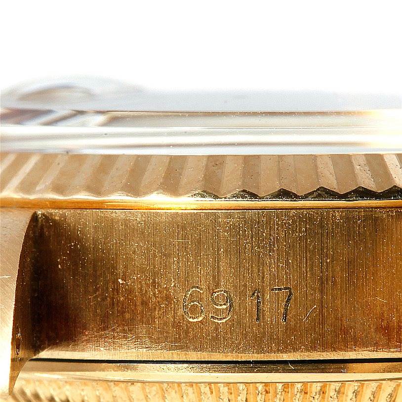 The image shows a close-up of the case side, serial number, and fluted bezel of a Rolex President 6917 Women's Yellow Gold Brown Dial 6917 Women's Yellow Gold Brown Dial model watch.