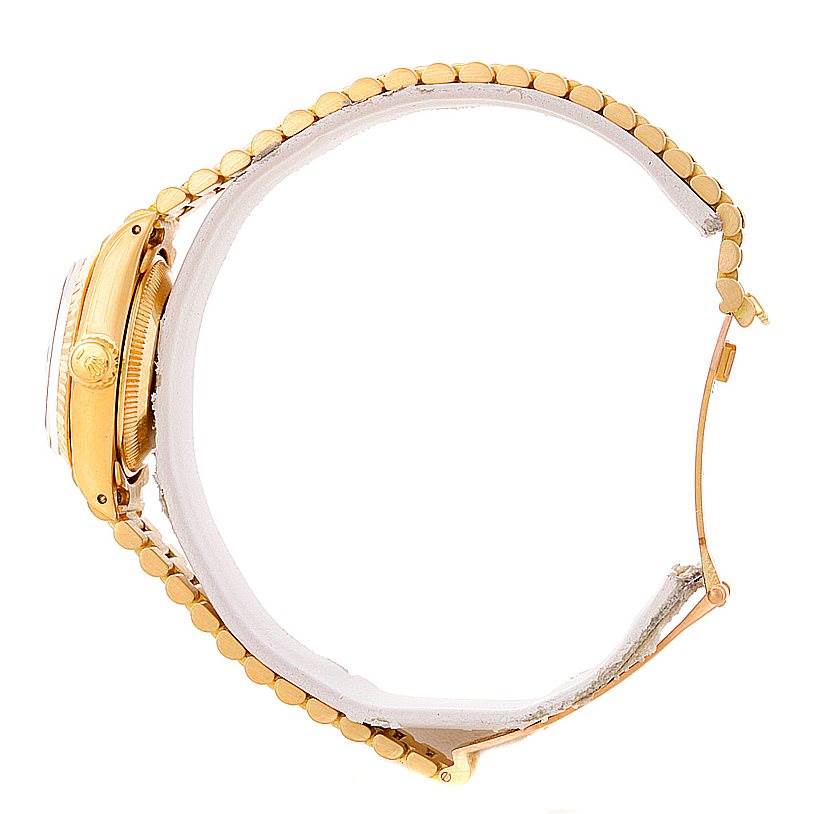 The image shows a side profile of the Rolex President 6917 Women's Yellow Gold Brown Dial 6917 Women's Yellow Gold Brown Dial model watch, detailing the case, crown, and partially open bracelet.