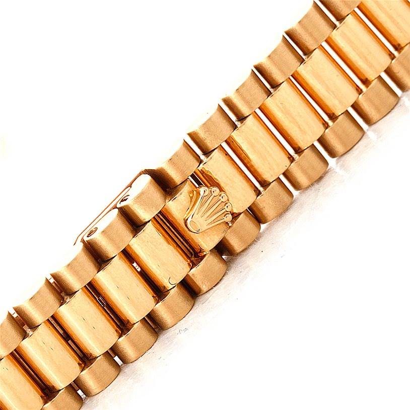 This image shows the gold bracelet of a Rolex President 69158 Women's Yellow Gold Champagne Dial 69158 Women's Yellow Gold Champagne Dial model, featuring the Rolex crown logo.