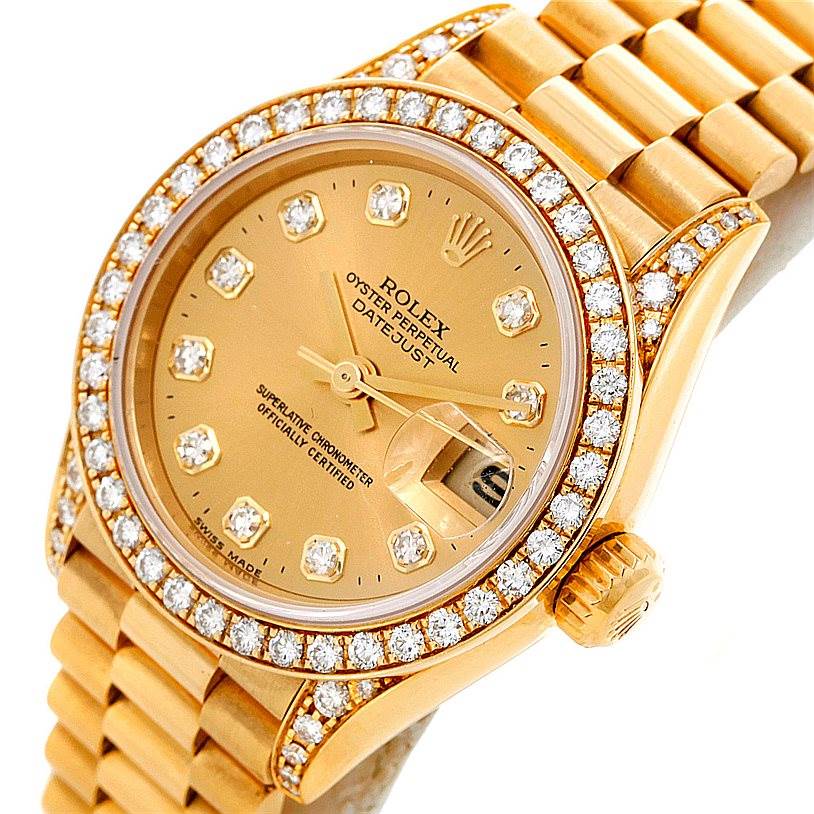 The image shows a close-up angle of a Rolex President 69158 Women's Yellow Gold Champagne Dial 69158 Women's Yellow Gold Champagne Dial model watch, featuring the dial, bezel with diamonds, crown, and part of the bracelet.