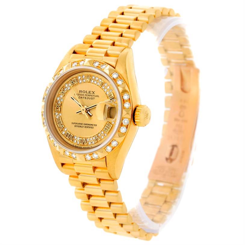 This image shows a Rolex President 69178 Women's Yellow Gold Champagne Dial 69178 Women's Yellow Gold Champagne Dial Datejust watch at an angled view, highlighting its golden case, diamond-encrusted bezel, and gold bracelet.