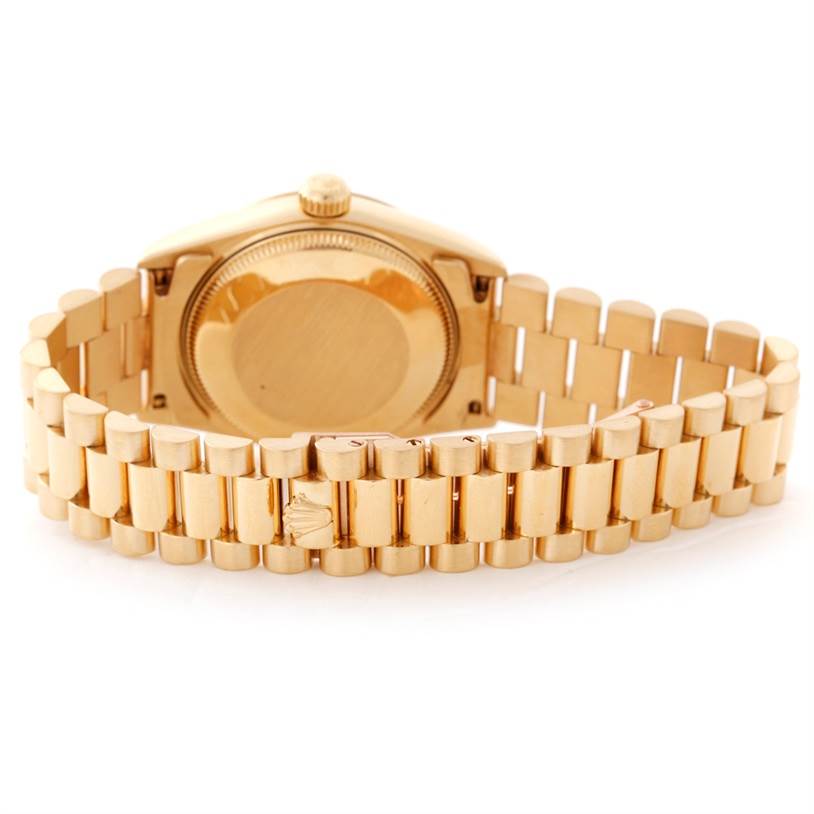 The image shows the back and bracelet of a gold Rolex President 68278 Women's Yellow Gold Champagne Dial 68278 Women's Yellow Gold Champagne Dial model watch, viewed from a rear angle.