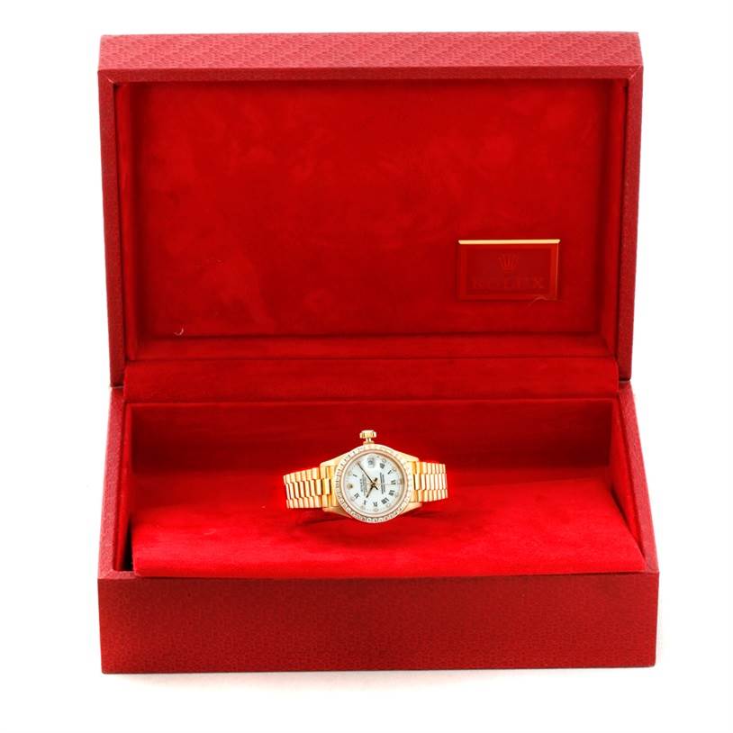 The Rolex President 69178 Women's Yellow Gold White Dial 69178 Women's Yellow Gold White Dial model watch is displayed front-on inside a red box with a red velvet lining.