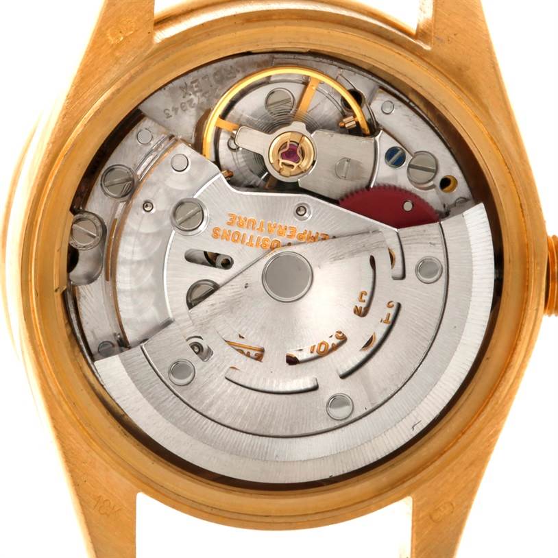 This image shows the back view of a Rolex President 69178 Women's Yellow Gold White Dial 69178 Women's Yellow Gold White Dial model watch, highlighting its intricate movement and internal components.
