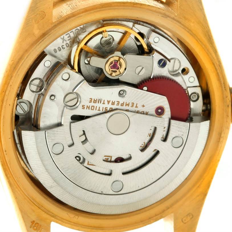 The image shows the internal mechanism of a Rolex President 69178 Women's Yellow Gold Mother of Pearl Dial 69178 Women's Yellow Gold Mother of Pearl Dial model watch from a rear angle.